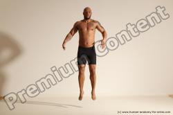 Underwear Gymnastic poses Man Black Muscular Bald Dancing Dynamic poses Academic